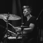 Black and white picture of Pop Rock Session Drummer performing on stage