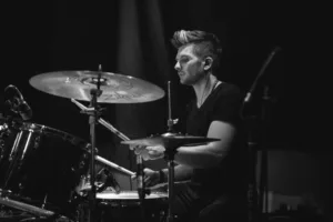Black and white picture of Pop Rock Session Drummer performing on stage