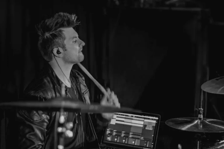 Remote session drummer playing rock beats on drum kit